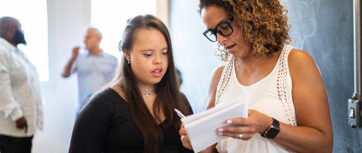 Woman with disability in classroom teaching